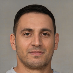 Neutral white adult male with short  brown hair and brown eyes