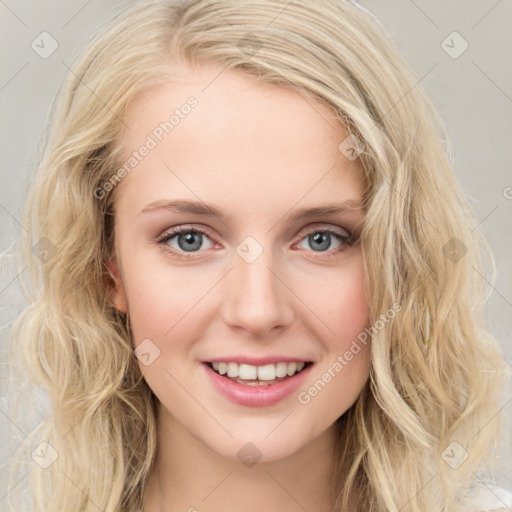 Joyful white young-adult female with long  brown hair and blue eyes