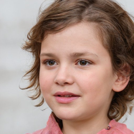 Joyful white child female with medium  brown hair and grey eyes