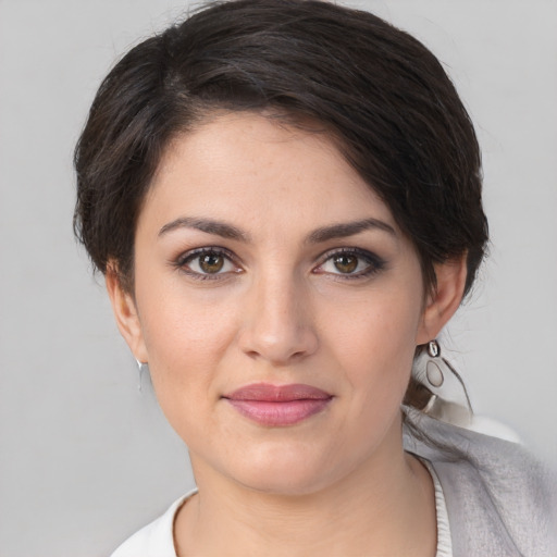 Joyful white young-adult female with medium  brown hair and brown eyes