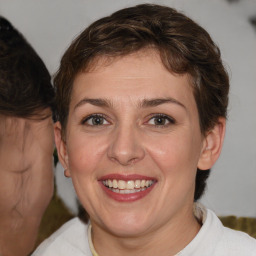 Joyful white young-adult female with medium  brown hair and brown eyes