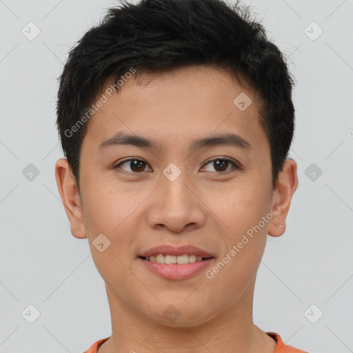 Joyful asian young-adult male with short  brown hair and brown eyes