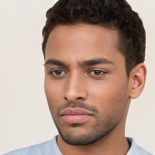 Neutral white young-adult male with short  black hair and brown eyes