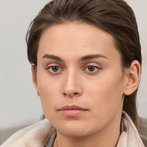 Neutral white young-adult female with medium  brown hair and brown eyes