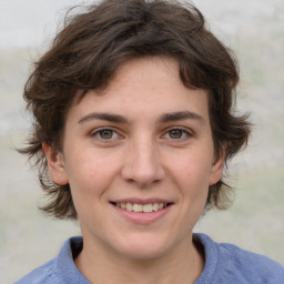 Joyful white young-adult female with medium  brown hair and blue eyes