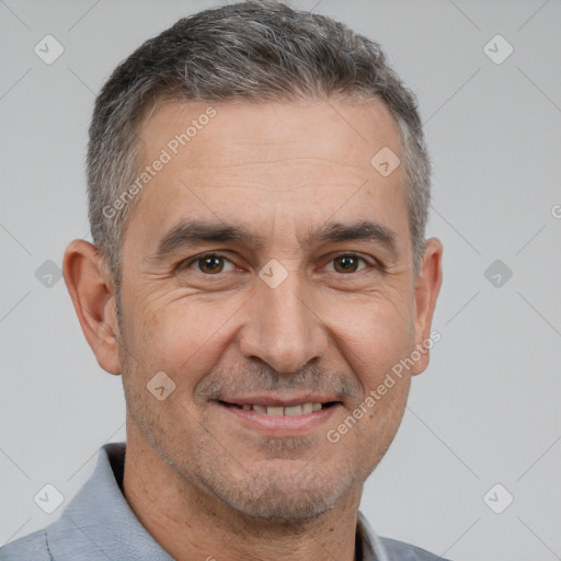 Joyful white adult male with short  brown hair and brown eyes