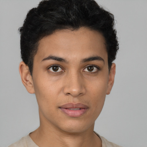 Joyful latino young-adult female with short  brown hair and brown eyes