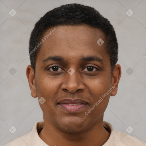 Joyful black young-adult male with short  black hair and brown eyes