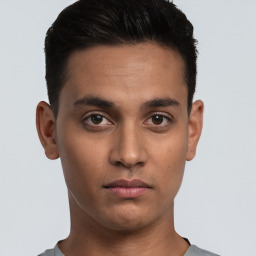 Neutral white young-adult male with short  black hair and brown eyes