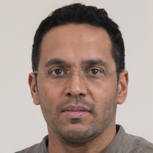 Neutral white adult male with short  black hair and brown eyes