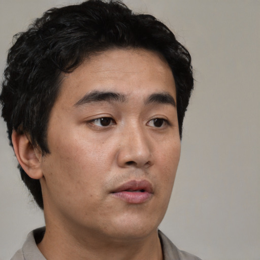 Neutral asian young-adult male with short  black hair and brown eyes