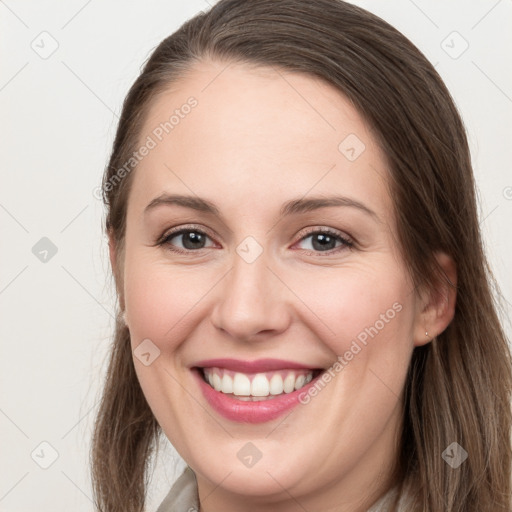 Joyful white young-adult female with long  brown hair and grey eyes