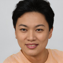 Joyful asian young-adult female with short  black hair and brown eyes