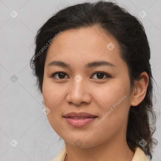 Joyful latino young-adult female with medium  brown hair and brown eyes