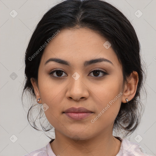 Joyful latino young-adult female with medium  black hair and brown eyes