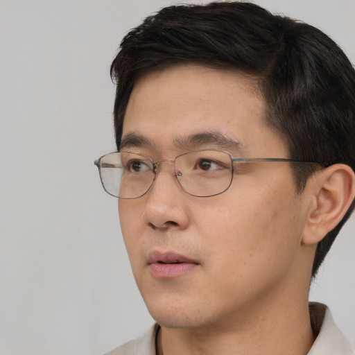 Neutral asian young-adult male with short  brown hair and brown eyes