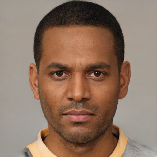 Neutral black young-adult male with short  black hair and brown eyes