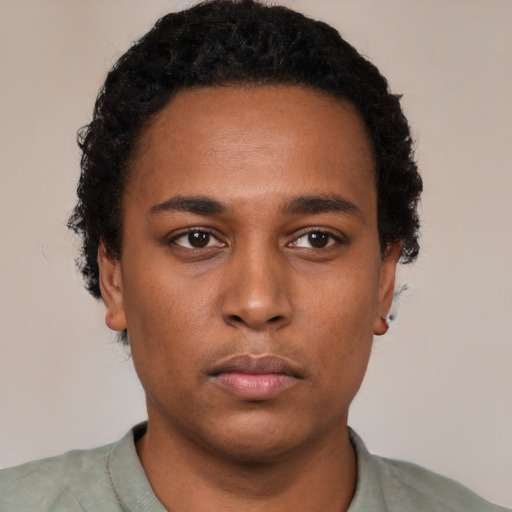 Neutral black young-adult male with short  black hair and brown eyes