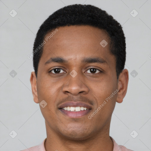 Joyful black young-adult male with short  black hair and brown eyes