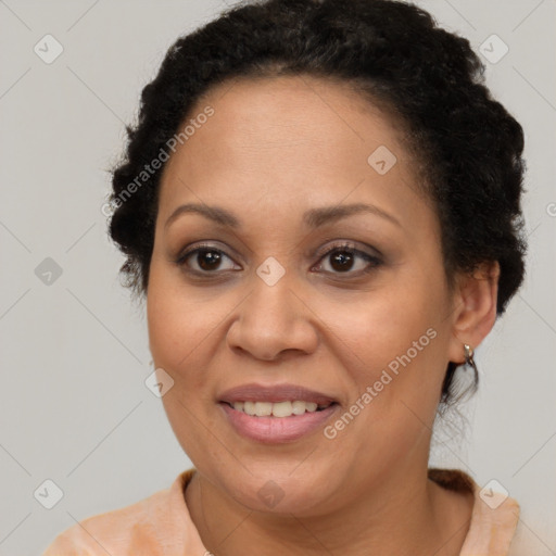 Joyful black adult female with short  brown hair and brown eyes