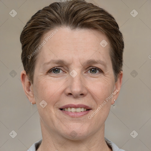 Joyful white adult female with short  brown hair and grey eyes