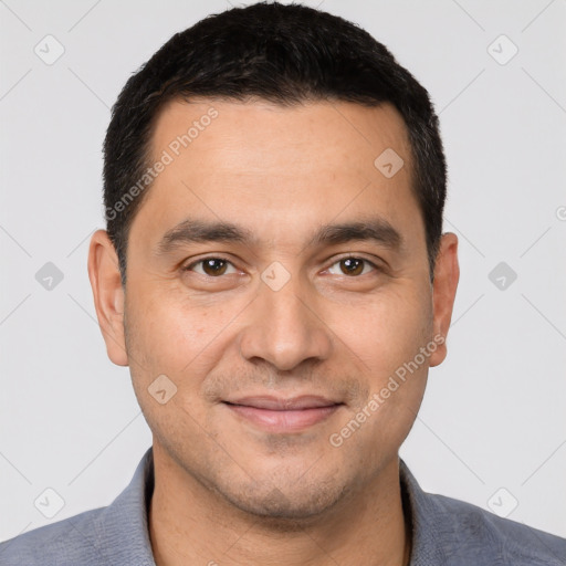 Joyful white young-adult male with short  black hair and brown eyes