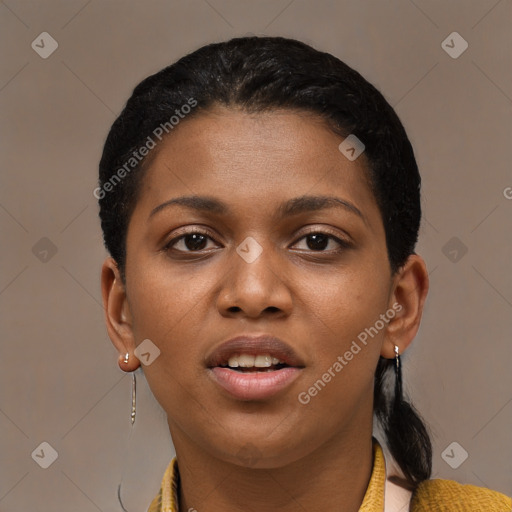 Joyful black young-adult female with short  black hair and brown eyes