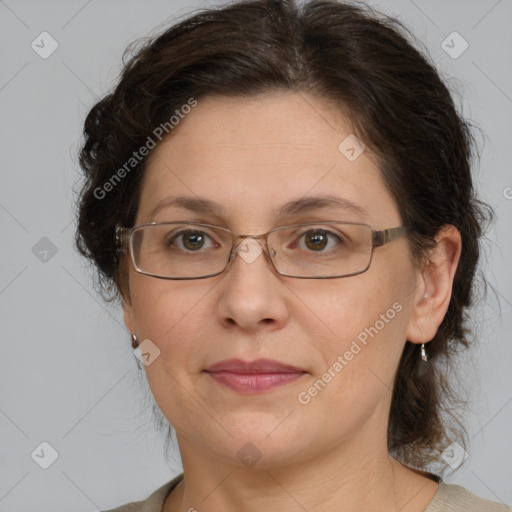 Joyful white adult female with medium  brown hair and grey eyes