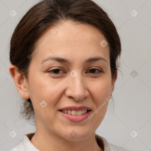 Joyful white adult female with medium  brown hair and brown eyes