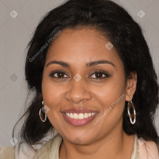 Joyful black young-adult female with long  brown hair and brown eyes