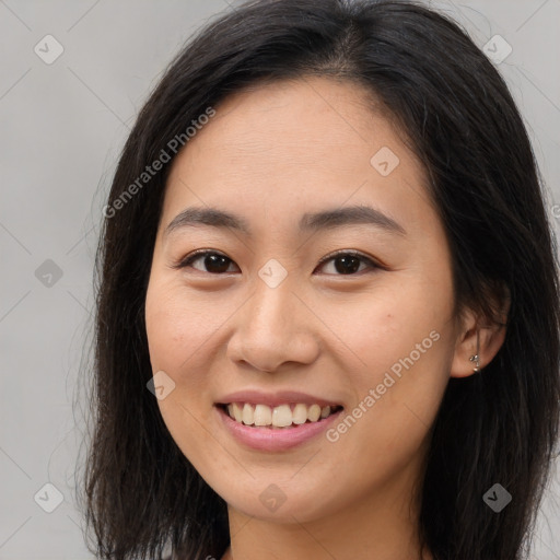 Joyful asian young-adult female with long  brown hair and brown eyes