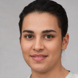 Joyful white young-adult female with short  brown hair and brown eyes