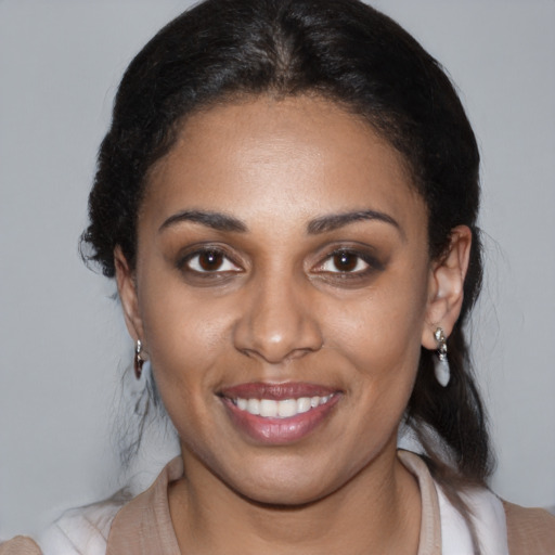 Joyful latino young-adult female with medium  black hair and brown eyes