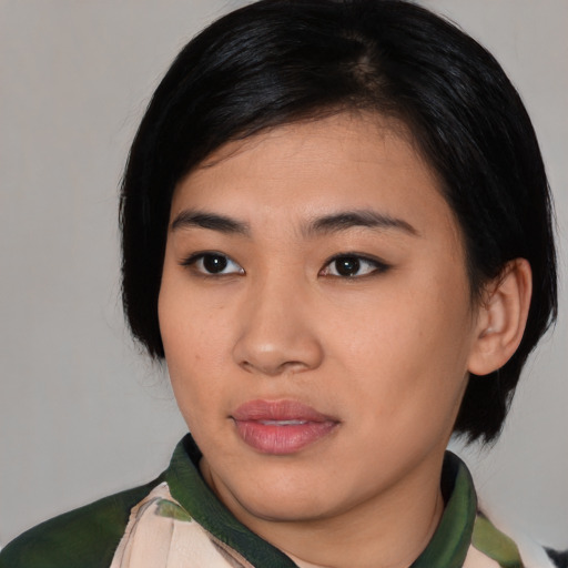 Neutral asian young-adult female with medium  black hair and brown eyes
