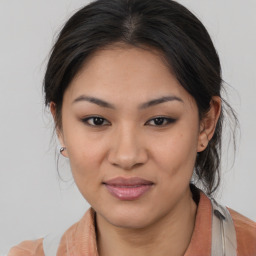 Joyful asian young-adult female with medium  brown hair and brown eyes