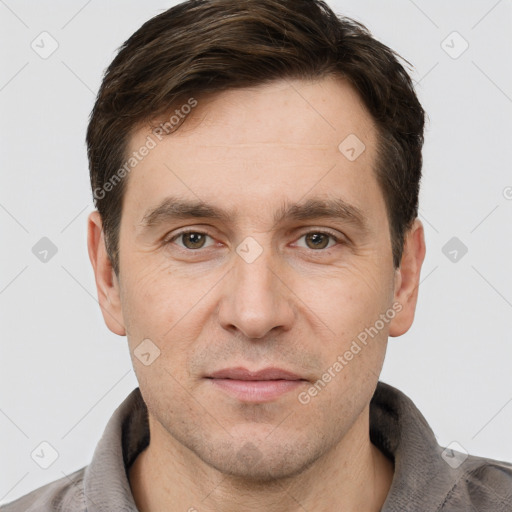 Joyful white adult male with short  brown hair and grey eyes