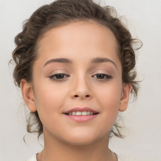 Joyful white child female with medium  brown hair and brown eyes