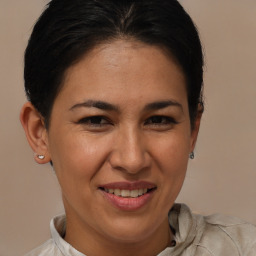Joyful white adult female with short  brown hair and brown eyes