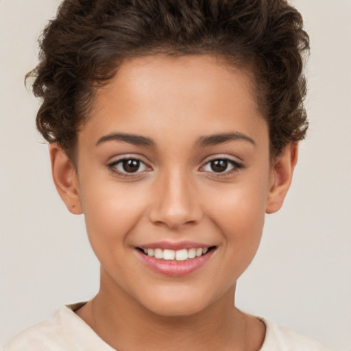 Joyful white child female with short  brown hair and brown eyes