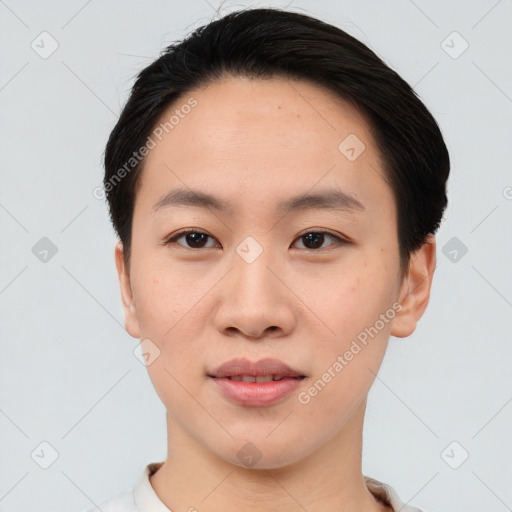 Joyful asian young-adult female with short  black hair and brown eyes