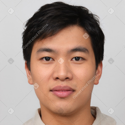 Joyful asian young-adult male with short  black hair and brown eyes