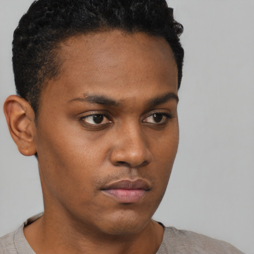 Neutral black young-adult male with short  brown hair and brown eyes