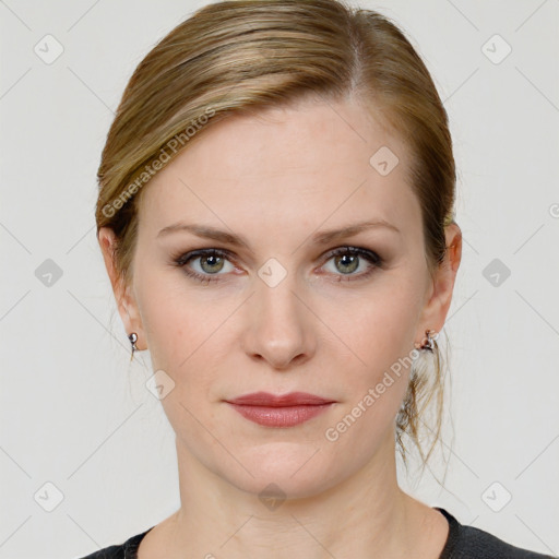 Joyful white young-adult female with medium  brown hair and blue eyes