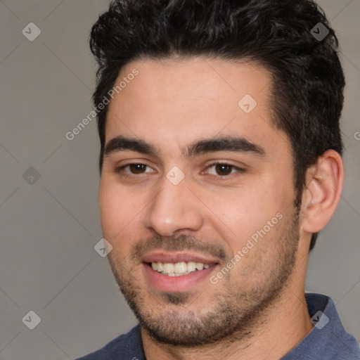 Joyful white young-adult male with short  black hair and brown eyes