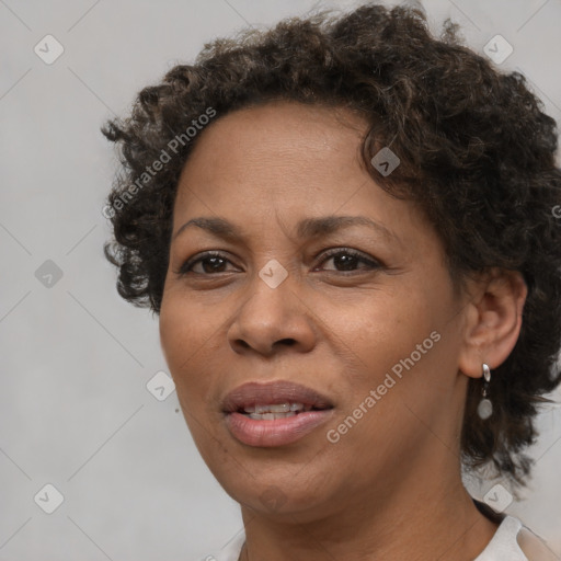 Joyful black adult female with short  brown hair and brown eyes