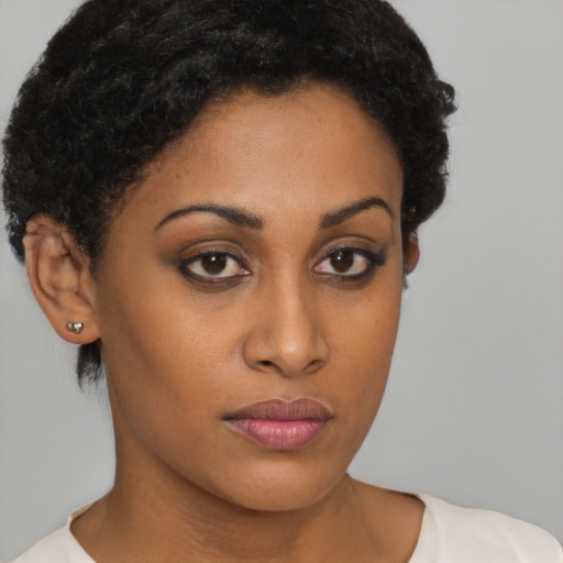 Neutral black young-adult female with short  brown hair and brown eyes