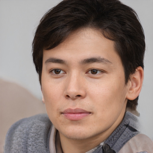 Joyful white young-adult male with medium  brown hair and brown eyes