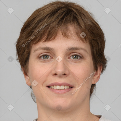 Joyful white young-adult female with medium  brown hair and grey eyes