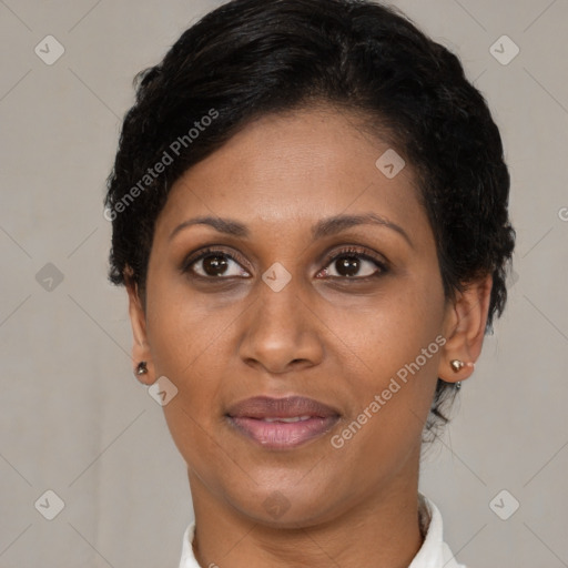 Joyful latino adult female with short  brown hair and brown eyes