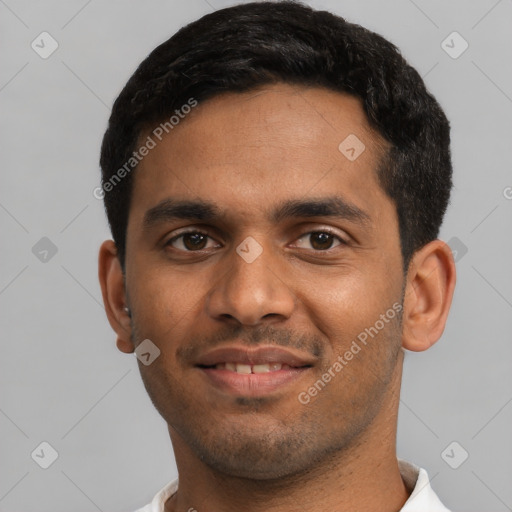 Joyful latino young-adult male with short  black hair and brown eyes